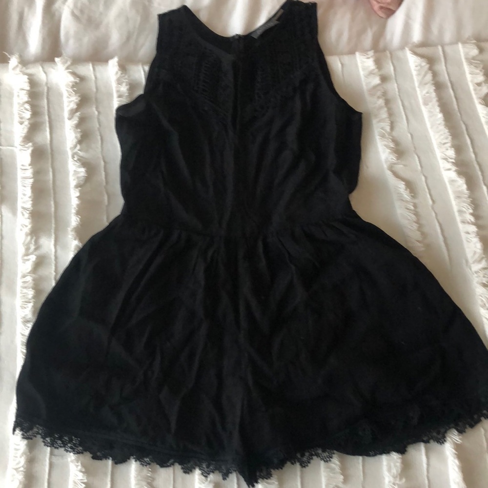 Black Astr romper with lace details